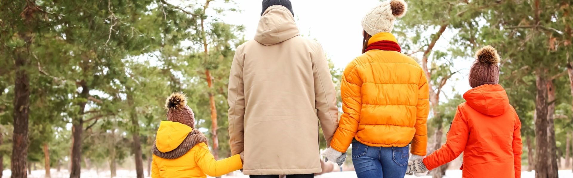 family in snowy woods